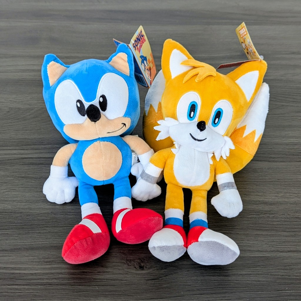 Sonic the Hedgehog and Tails stuffed toys on a table